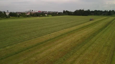 Drone Moving in for a Close-Up as the Hay Tedder Works 스톡 동영상 345012897