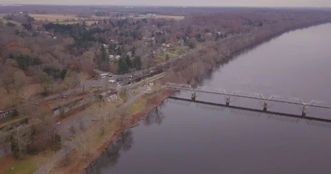 Drone moving down towards end of bridge river Stock Footage 98839420