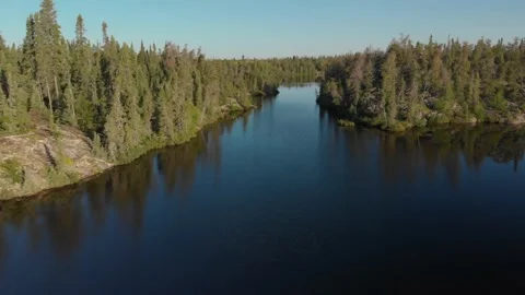 Drone moving forward above beautiful blue lake  Stock Footage 137037075