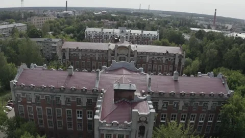 Drone moving forward above town and historic complex Stock Footage 333012402