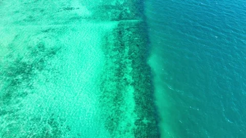 Drone moving forward along turquoise and deep blue waters, Koh Ngai – 4K Stock-Footage 325022364
