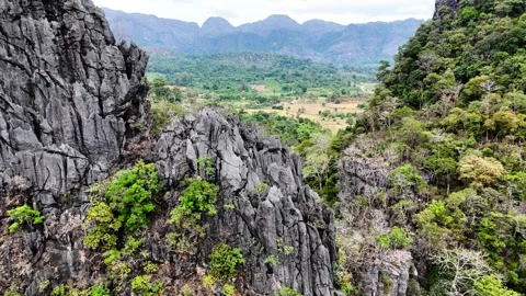 Drone moving forward over karst mountains at Vang Vieng, Laos – 4K Stock Footage 325079440