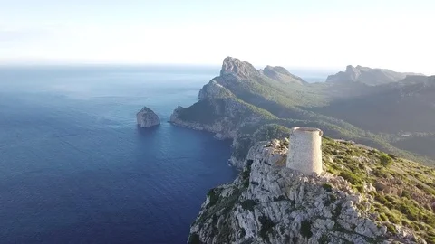 Drone moving forward passing tower of Formentor 스톡 동영상 101428389