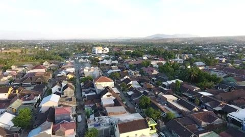 Drone moving forward of small city in Lombok, Indonesia Stock Footage 131580334