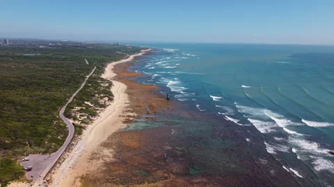 Drone Moving Forward Towards Beacon with Sea, Coast, Waves, Green Landscape, Coa Stock Footage 306313114