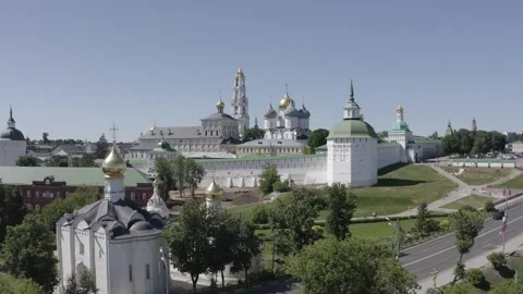 Drone moving forward upward above historic church complex 動画素材 332019759