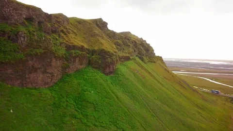 Drone moving forwards above the big Seljalandsfoss waterfalls in Iceland, 2K Stock Footage 148750157