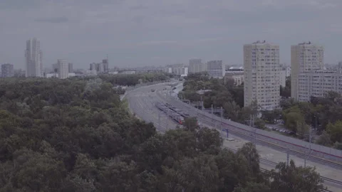 Drone moving left over railway and green urban area, D-Log footage Vidéo 320803344