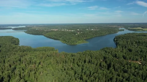 Drone moving over river forest and houses Stock Footage 320120528