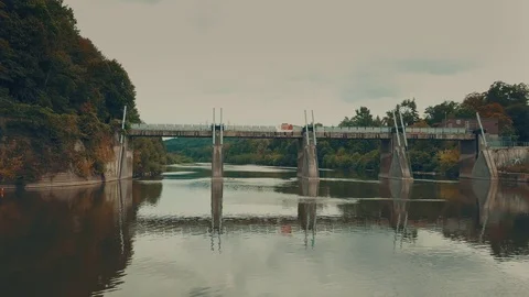 Drone moving over river under damn gates and climb upwards 库存影片 79726752