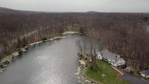 Drone moving over small lake 스톡 동영상 106651154