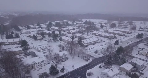 Drone moving over winter snow fall town road Stock Footage 101126222