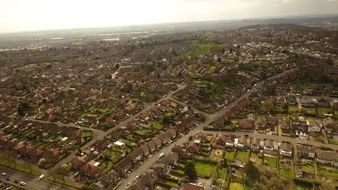 Drone moving shot of a city scape estate, aerial view of housing and land Stock Footage 89194183