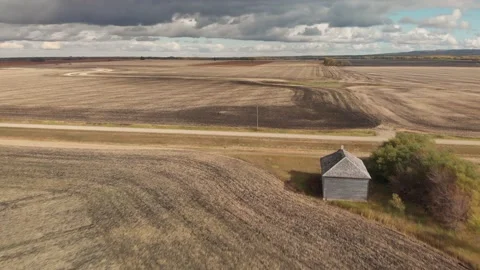 Drone moving slowly forward towards an old schoolhouse Stock Footage 141830581