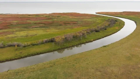 Drone moving slowly over a vast area with large meadows Stock Footage 117697663