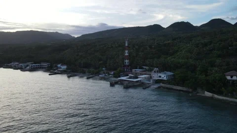 Drone is moving toward to the coast then following the road Stock Footage 301603980