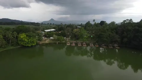 Drone is moving towards - rainy clouds , lake at the Philippines Stock Footage 301618875