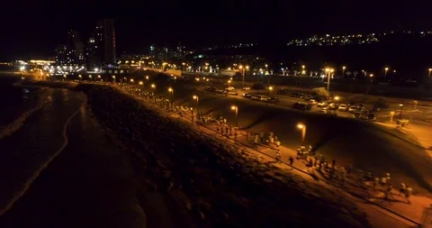 Drone Night City Run shot Sport marathon runners running at night Crowd Stock Footage 89921945