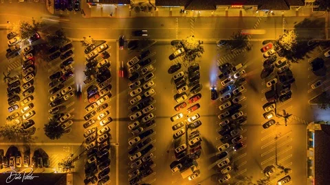 Drone night hyperlapse of busy grocery store parking lot at night Stock Footage 87903571