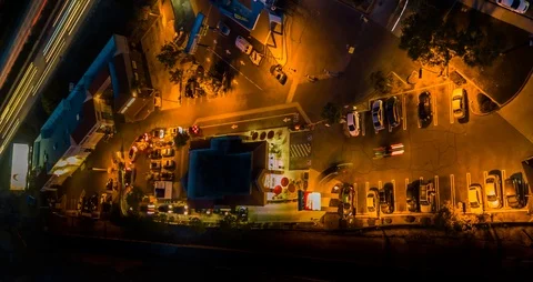 Drone night hyperlapse of cars lined up for fast food near a freeway side view Stock Footage 86576782