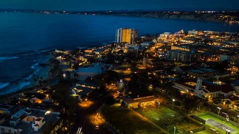 Drone night hyperlapse of resort town of La Jolla as camera pulls back Stock Footage 86832771