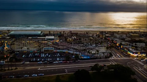 Drone nightlapse of long exposure video of roller coaster at beach Stock Footage 97190045