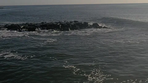Drone ocean fly over rocks waves crash 4 120fps Stock Footage 151540640