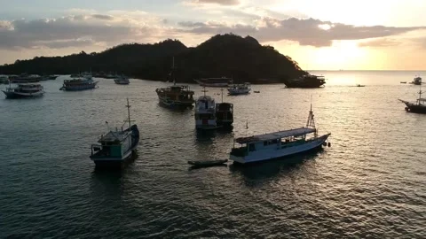 Drone, ocean sunset, boats floating in a harbour, Indonesia Video stock 131436847