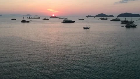 Drone, ocean sunset, boats floating on the calm ocean, Komodo Indonesia Stock Footage 131436934