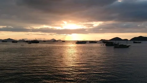 Drone, ocean sunset, orange sky and boat silhouettes Stock Footage 131436961