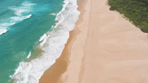 Drone of ocean waves crashing on the beach Stock Footage 304267237
