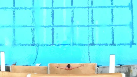 Drone Olympic Public Pool Man Slow Diving 4K 30FPS Stock Footage 195253249