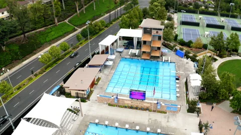 Drone Olympic Public Pool Wide Establishing 4K 30FPS Stock Footage 195256028