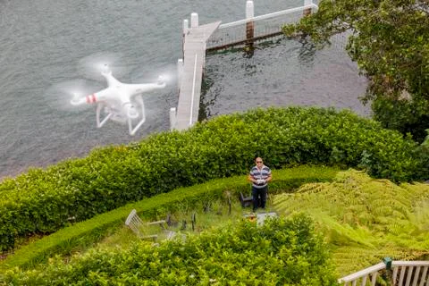 Drone Operator flying a drone - seen from above Stock Photos