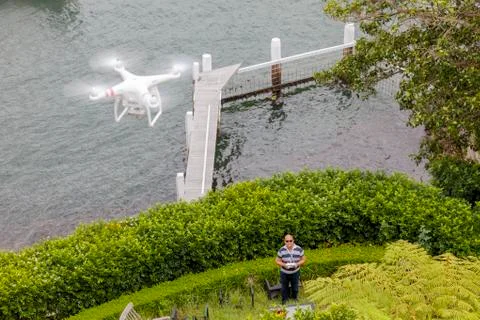 Drone Operator flying a drone - seen from above Stock Photos