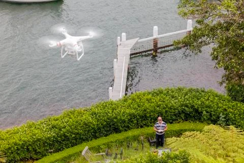 Drone Operator flying a drone - seen from above Stock Photos