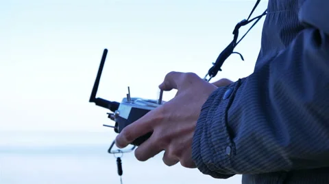 Drone Operator  Holding A Transmitter. 4K 3840x2160 Stockbeeldmateriaal 49057951