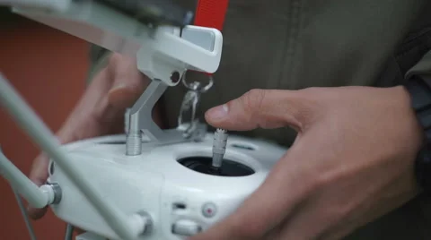 Drone operator holding a transmitter Stock Footage 68299790