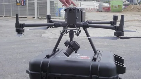 Drone operator turning on a Dji Matrice 300 drone Stock Footage 170889989