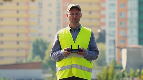 Drone operator in uniform controls an unmanned aerial vehicle Stock-Footage 115919520