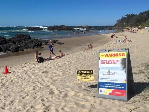 Drone operators on Australian beach Stock Photos