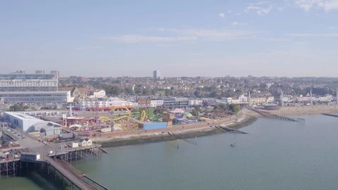 Drone or aerial pull back reveal of Southend pier and beach showing the 스톡 동영상 129521203