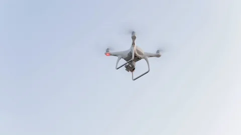 Drone or quadcopter flying with side lights in blue sky. Stock Footage 119249789