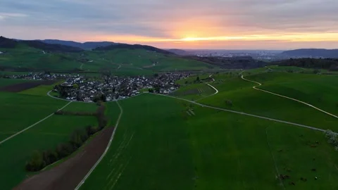 Drone orbit above Arisdorf toward Basel, Basel-Landschaft, Switzerland at sunset Stock Footage 342268031