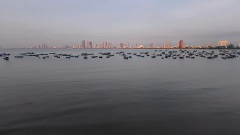 Drone Orbit Along Da Nang Coastline with Fishing Boats at Sunrise Stockbeeldmateriaal 340487362