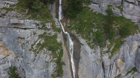 Drone Orbit Around Cascading Waterfall in Swiss Mountains Stock Footage 313562843