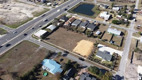 Drone orbit around developing empty plot of urban neighborhood with surrounded Stockbeeldmateriaal 328693795