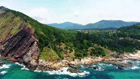 Drone orbit around dramatic coastal volcanic rock formations 4K Stock Footage 340068349