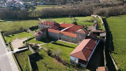 Drone orbit around entrance of rectangular angular monastery in Ourense Stock Footage 265445642