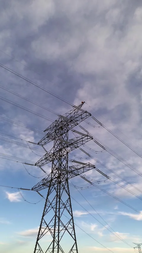 Drone Orbit Around High Voltage Transmission Tower for Grid Modernization Stock Footage 329894890